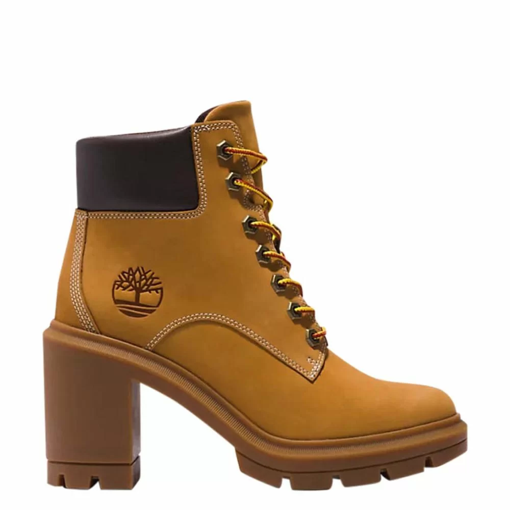 Green timberlands with store orange laces